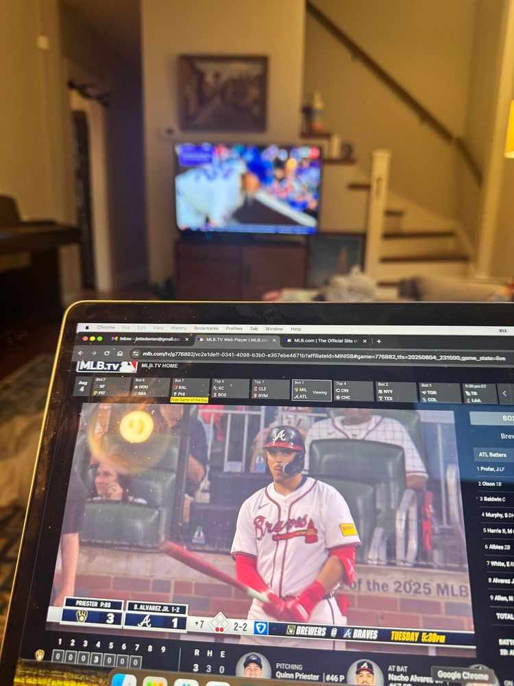 Photo of a baseball game on my laptop (brewers / braves) and on the tv. Cubs/reds
