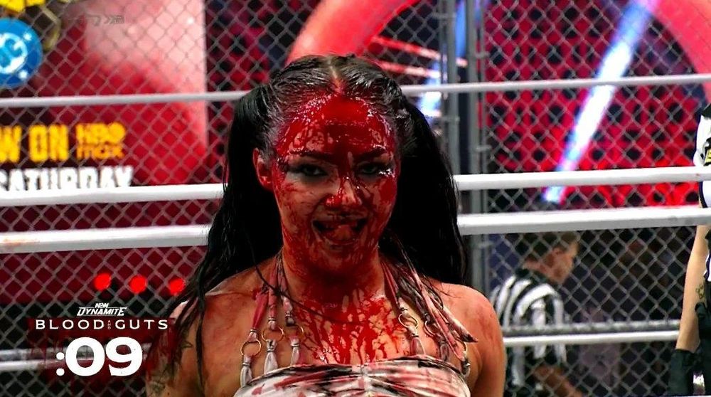 Skye Blue from the Blood and Guts match smiling while having a bloody face
