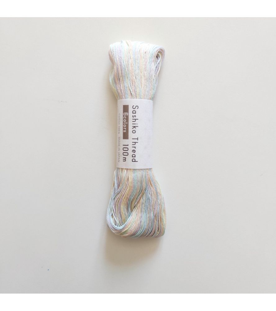 Photograph of variegated sashiko thread in faint pink, blue, and purple. Picture from japonerias.com.