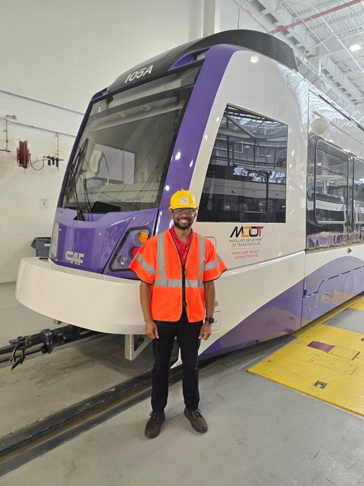 Me standing in front of a Purple Line Train.