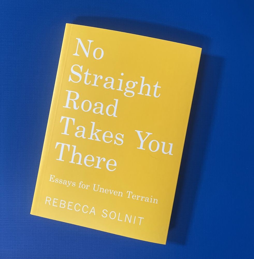 a yellow book cover on a blue background
No Straight Road Takes You There: Essays for Uneven Terrain by Rebecca Solnit
