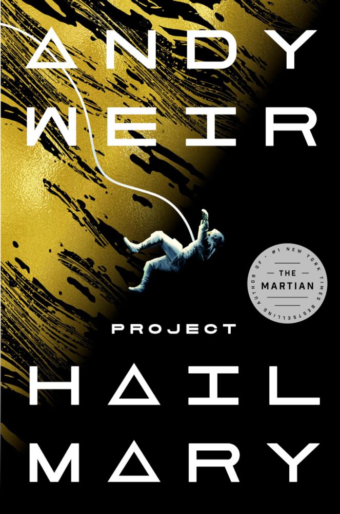 The cover of Project Hail Mary features a black background with the yellow, textured surface of a planet beneath the astronaut. At the center, a lone astronaut in a spacesuit is floating or tumbling upside-down, arms outstretched. The astronaut's suit is illuminated by a soft golden light, creating contrast against the dark background. The title, "Project Hail Mary," is displayed in bold, white block letters, with Andy Weir's name above it in slightly smaller text. The overall layout is clean and focused on the astronaut.