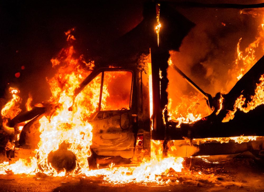 Burning stolen delivery van at night