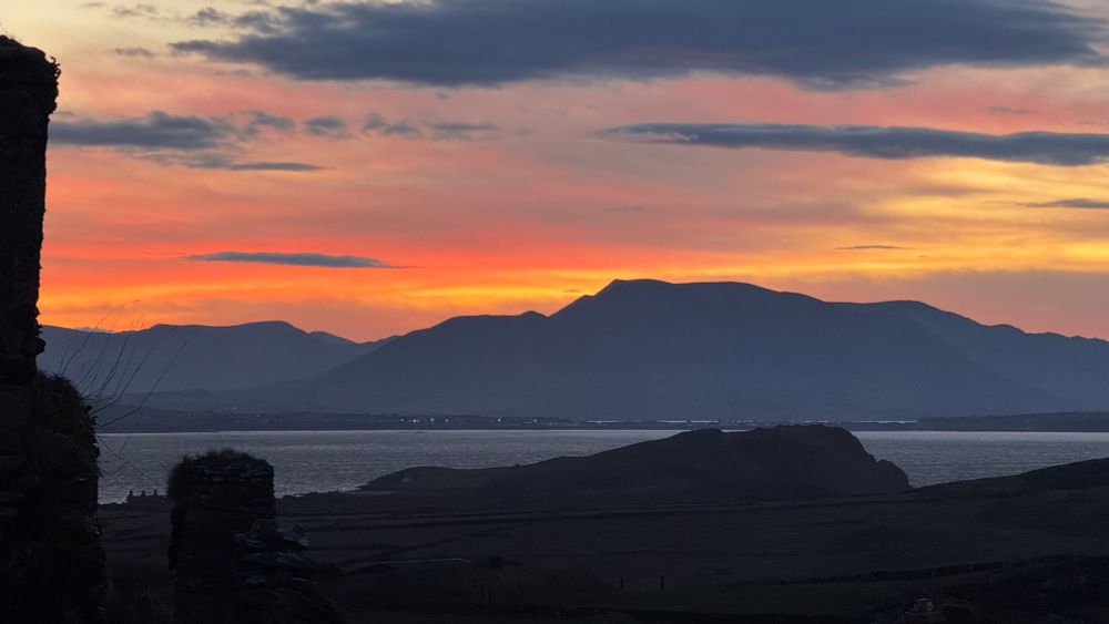 Sun rising over mountains in Ireland. 