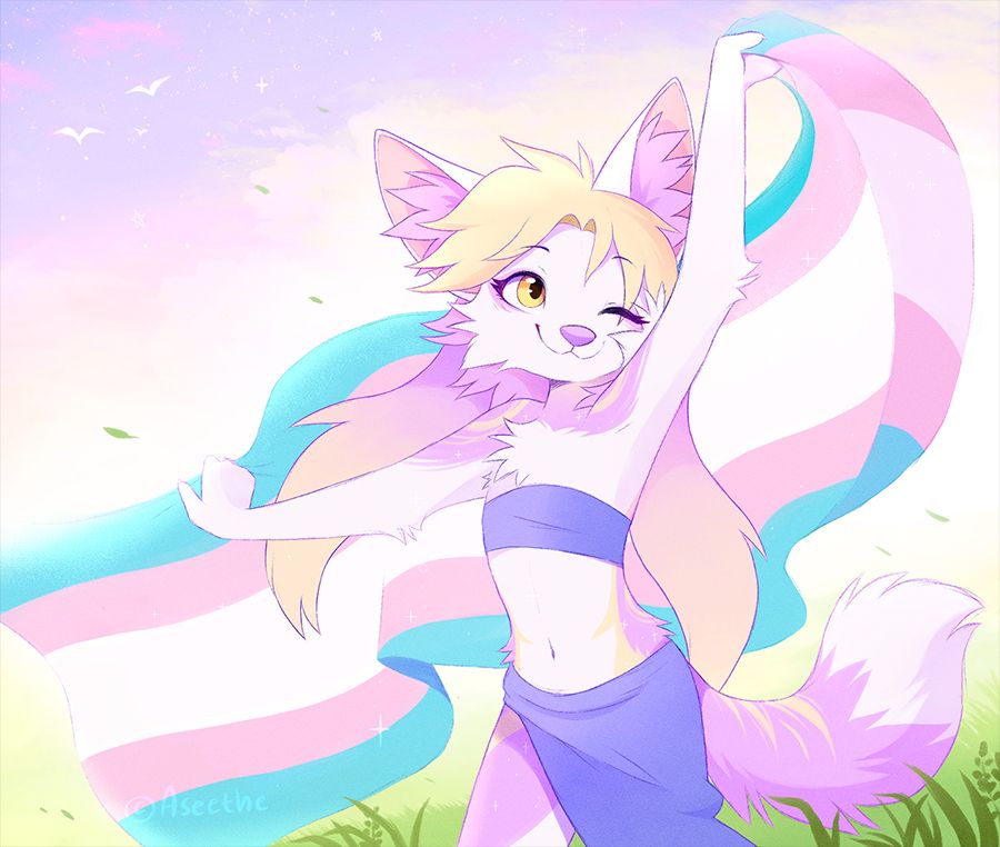 Anthropomorphic fennec fox with white and pink fur and blonde and pink hair. She is holding out a large transgender flag behind her, letting it flow in the breeze while standing out in a grassy field.