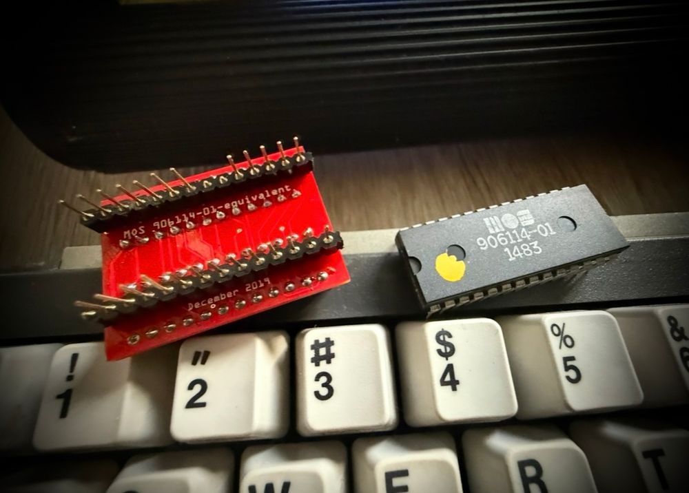 two broke C64 PLAs, one with bent pins, the other original one internally damaged.