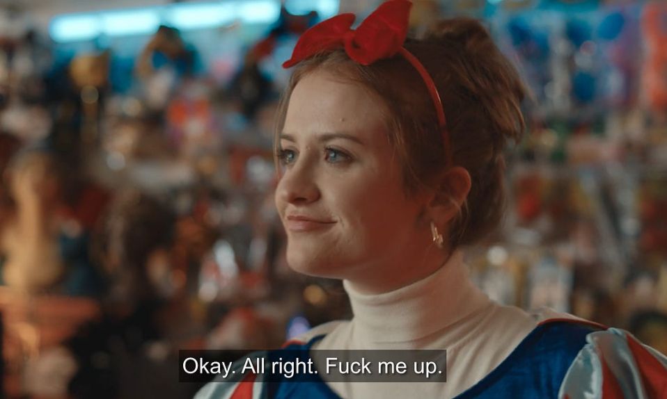 A woman wearing a red hair bow looks semi-hopeful and the text beneath her says "Okay. All right. Fuck me up." The woman is Máiréad Tyers as Jen in the great TV show Extraordinary.