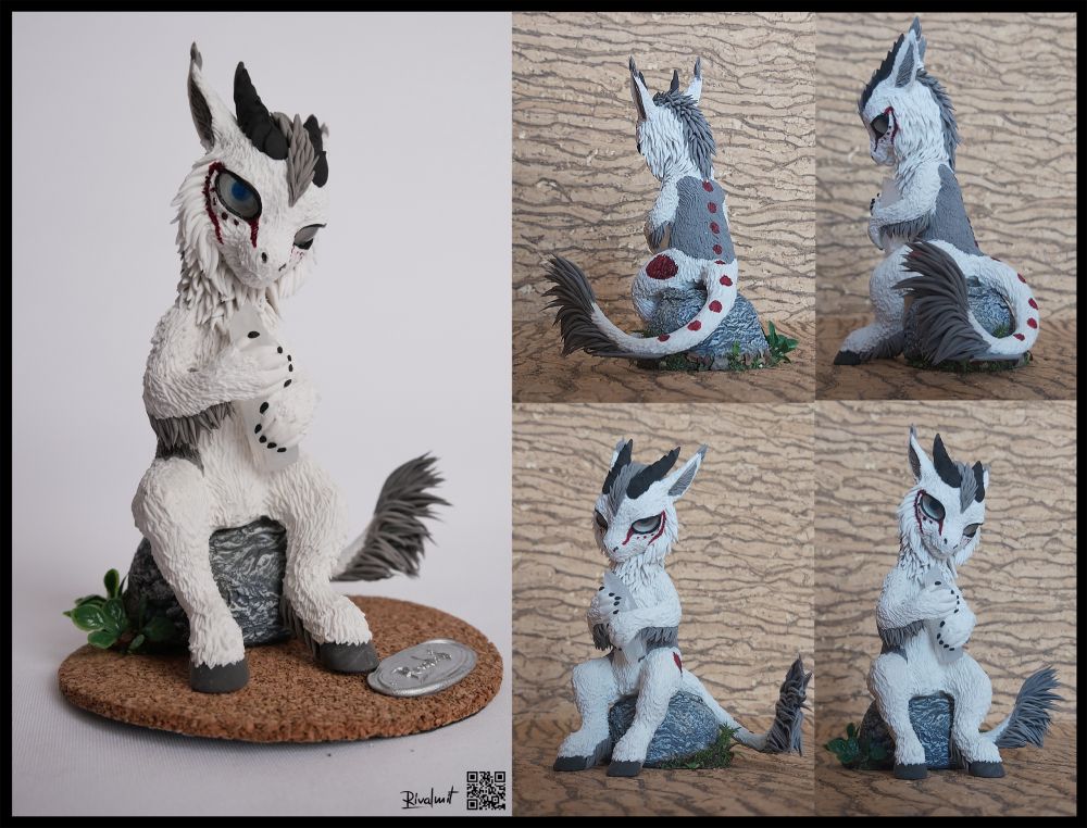 Sculpture of a dragopn with a scrystal