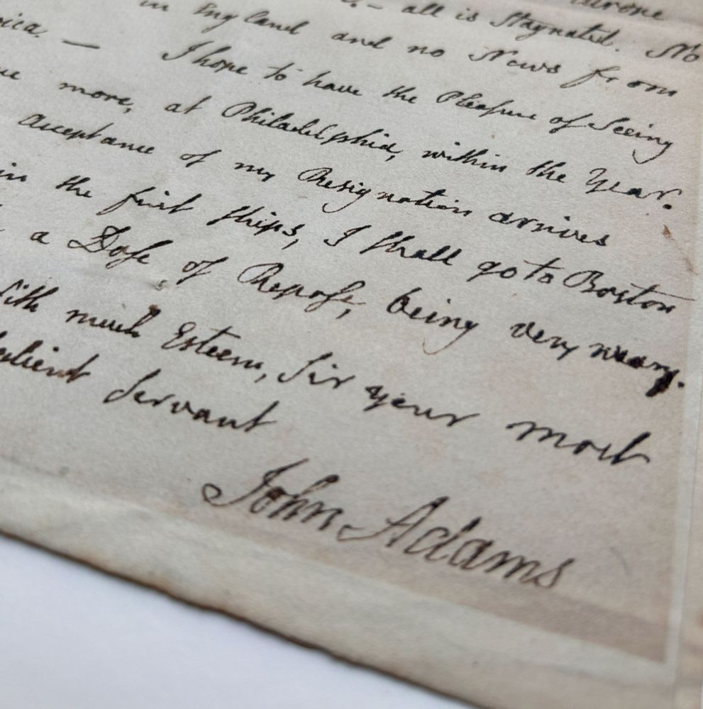 Letter written by John Adams in 1783 seen at angle showing his signature.