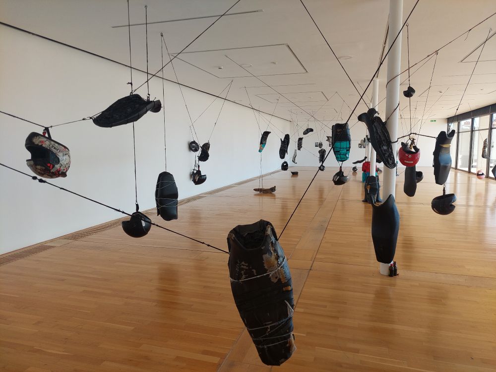 Motorbike seats hanging from the ceiling in the De La Warr Pavilion 
