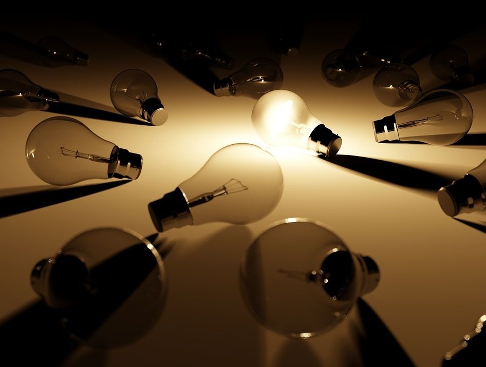 A single illuminated light bulb among many unlit ones. Image credit: Pixabay user ColiN00B.