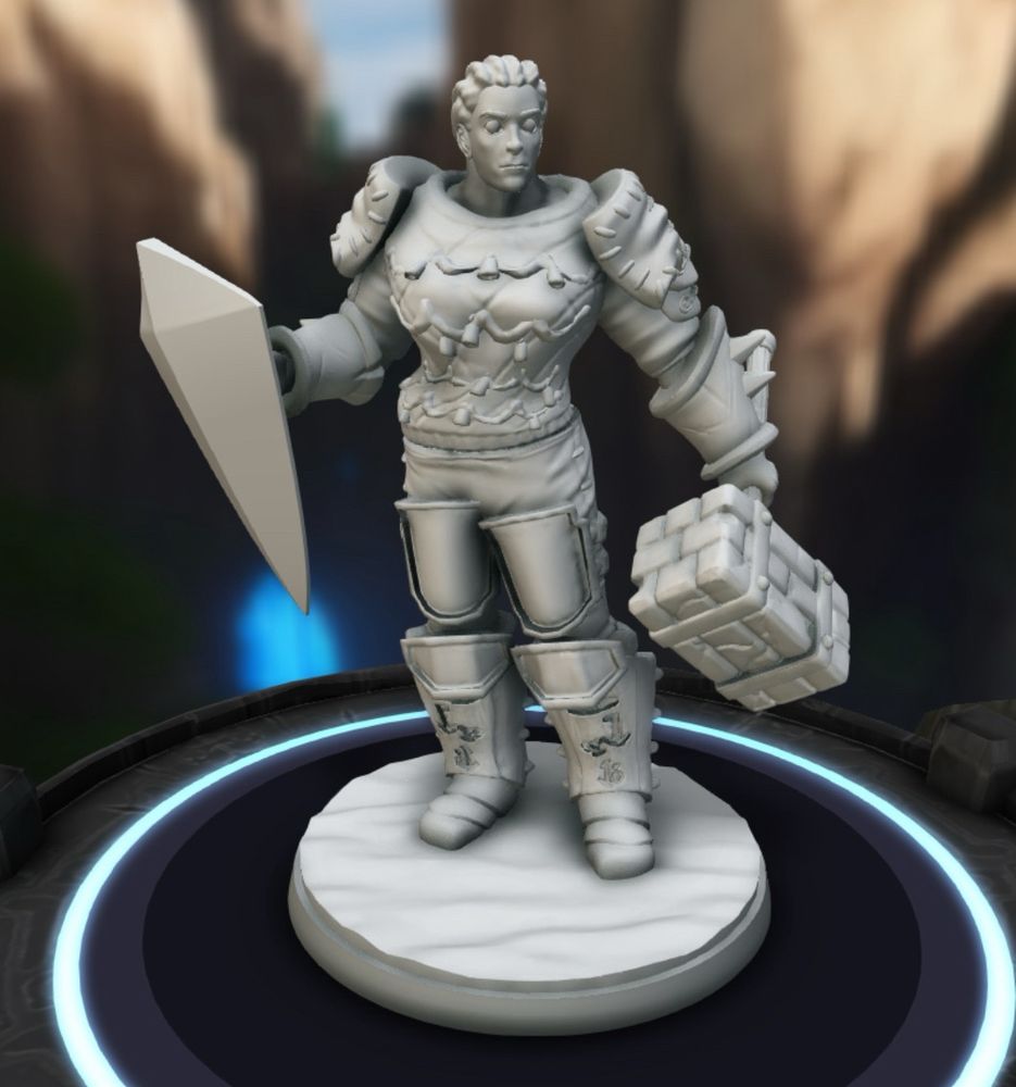 Figurine d’un personnage de jeu de rôles représentant une femme humaine inspirée d’un archétype guerrier tenant un marteau en main gauche et un bouclier en main droite