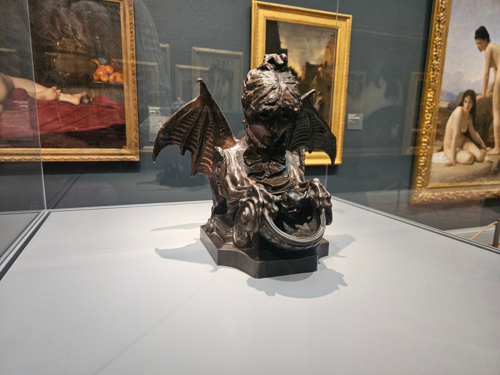 Bronze sculpture of the actress Sarah Bernhardt as a chimera, featuring bat wings and lions claws. 