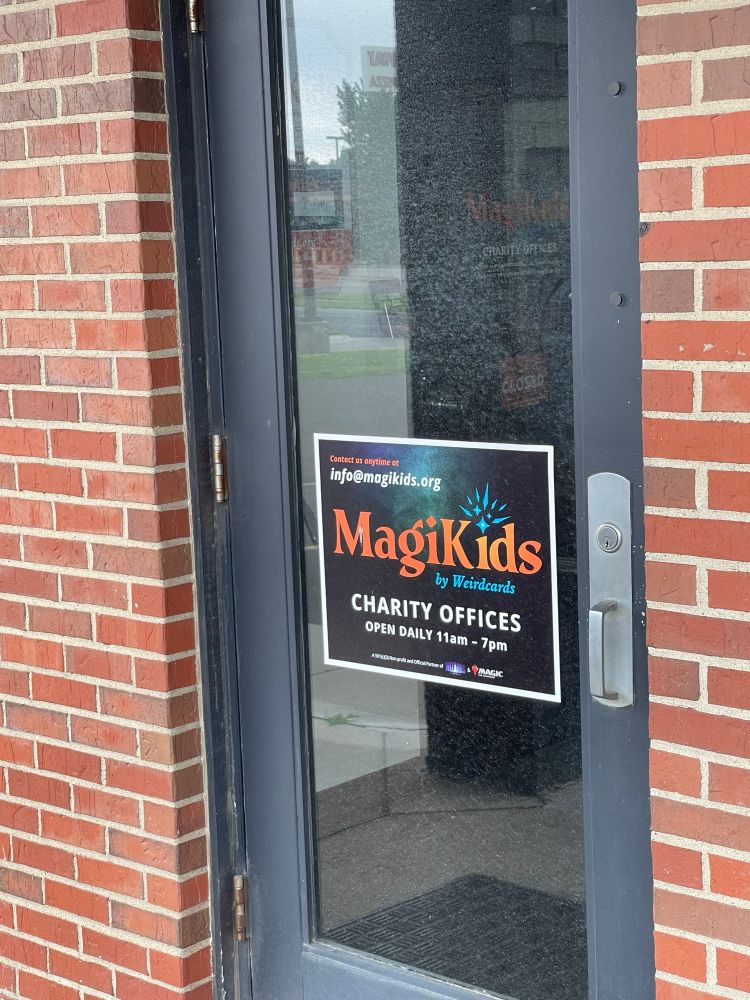 A sign of the business on a door 