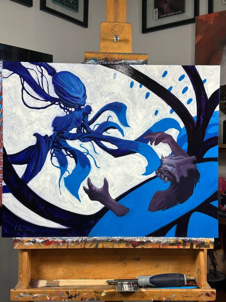 Cryoshatter, a Magic the gathering pairing by Jeremy Wilson sits on an easel. The painting is largely blues and whites of a jellyfish esque creature and a beast like monster fighting each other. The jellyfish is winning 