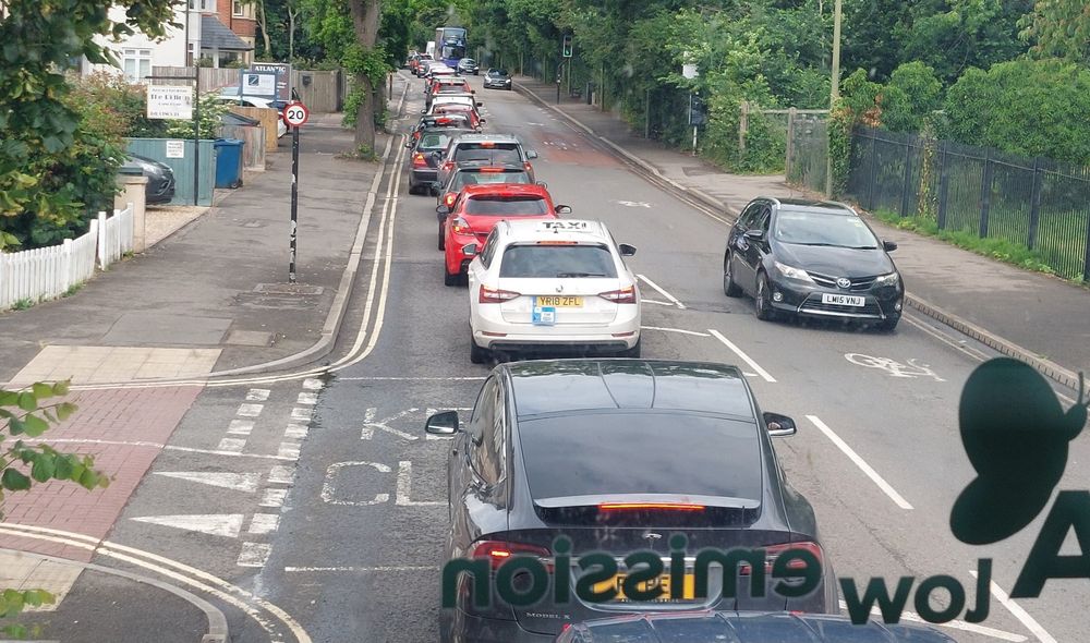 A view from the front of a bus on to a long traffic jam, on Abingdon Road, Oxford