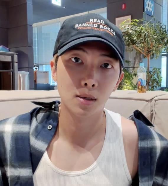 RM of BTS wearing a "Read Banned Books" cap