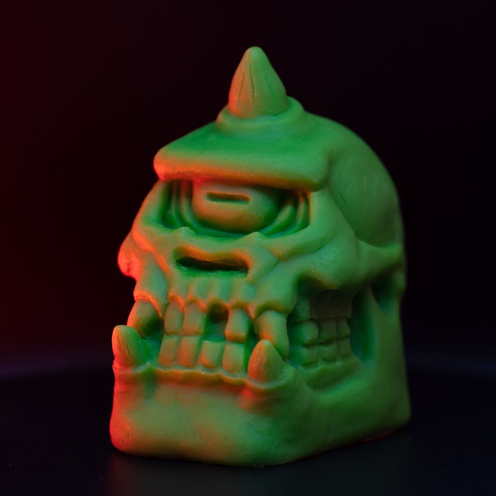 Neon green resin cyclops skull figurine