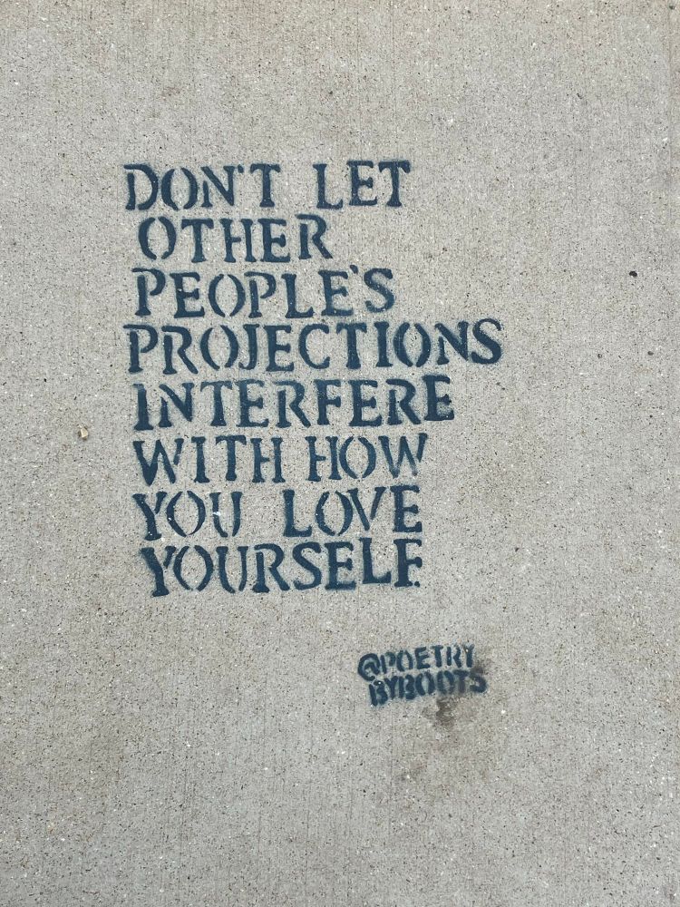 Blue or black stencil letters read “don’t let other people’s projections interfere with how you love yourself” signed @poetrybyboots

Found on the sidewalk at Hampton Beach, New Hampshire USA  