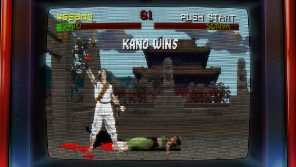 Kano holds the still-beating heart of his victim