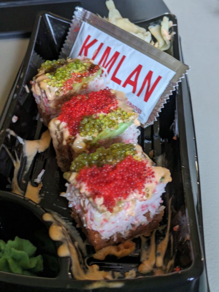 The picture shows a few cubes of oshizushi sushi. 
