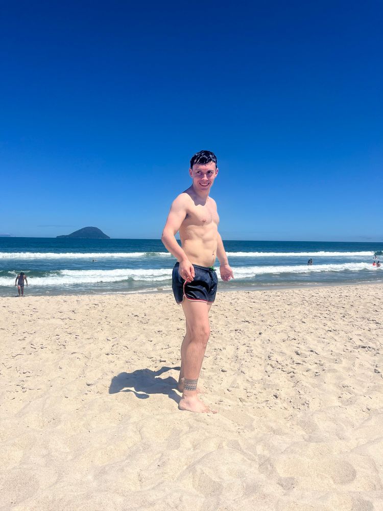 Me on a beach, side on