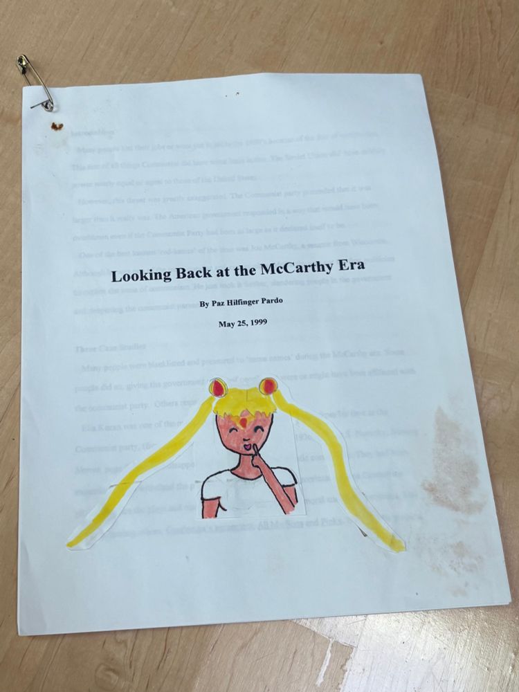 A stained report titled "Looking Back at the McCarthy Era" by me, May 25th 1999, title page featuring a big drawing of Sailor Moon. The pages are held together with a staple and a safety pin.