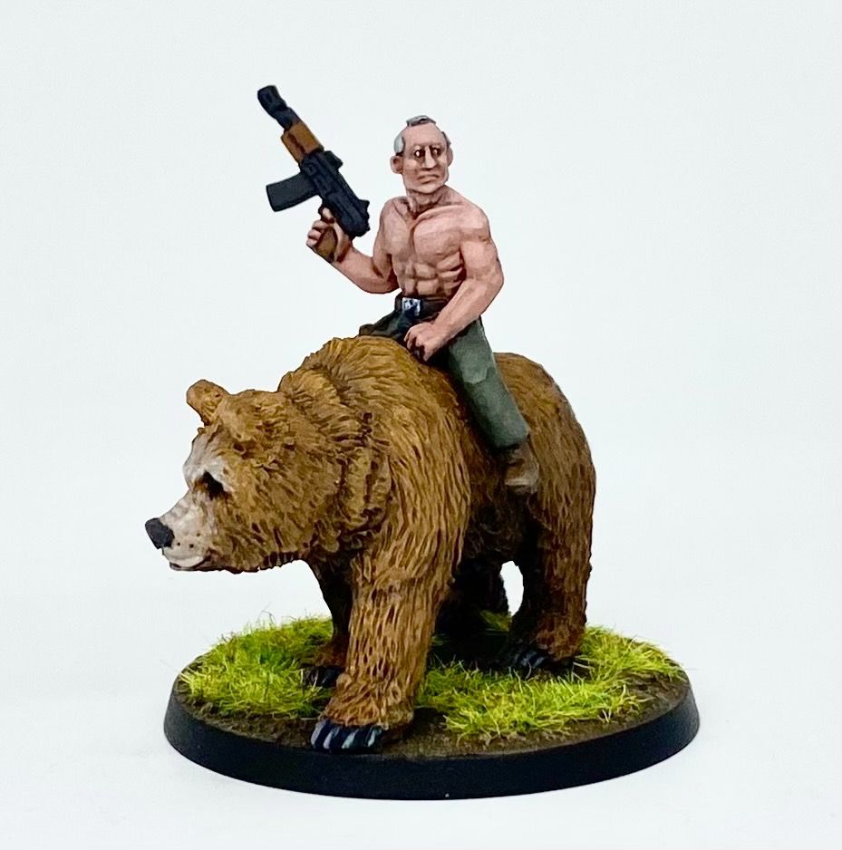 Putin on a bear, shirtless and holding an AK 47 that I really should have painted gold... but didn't