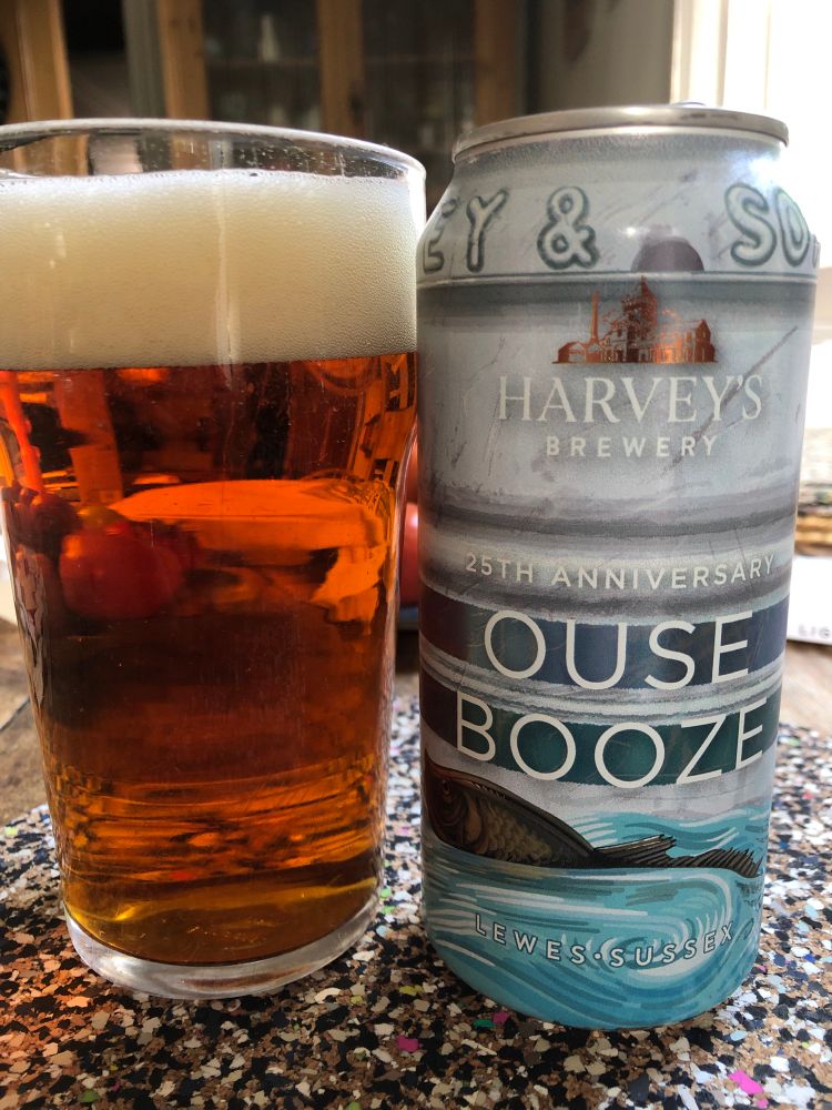 An amber ale. The can has a picture of a river in flood and a fish. 