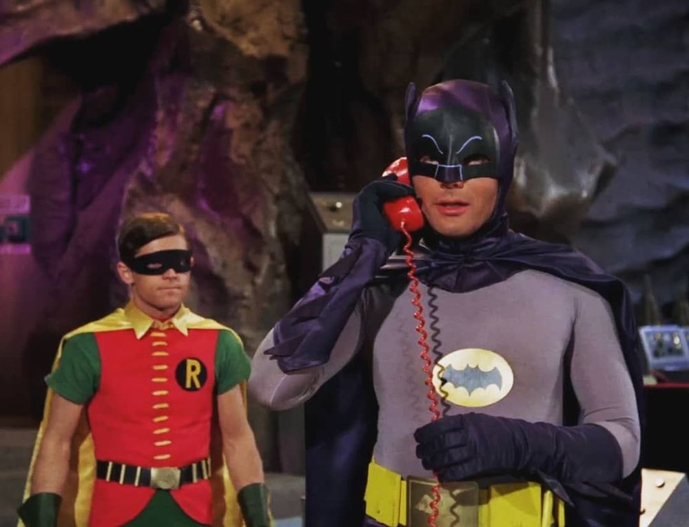 60s, Adam West, Batman, taking a phone call with Robin behind him