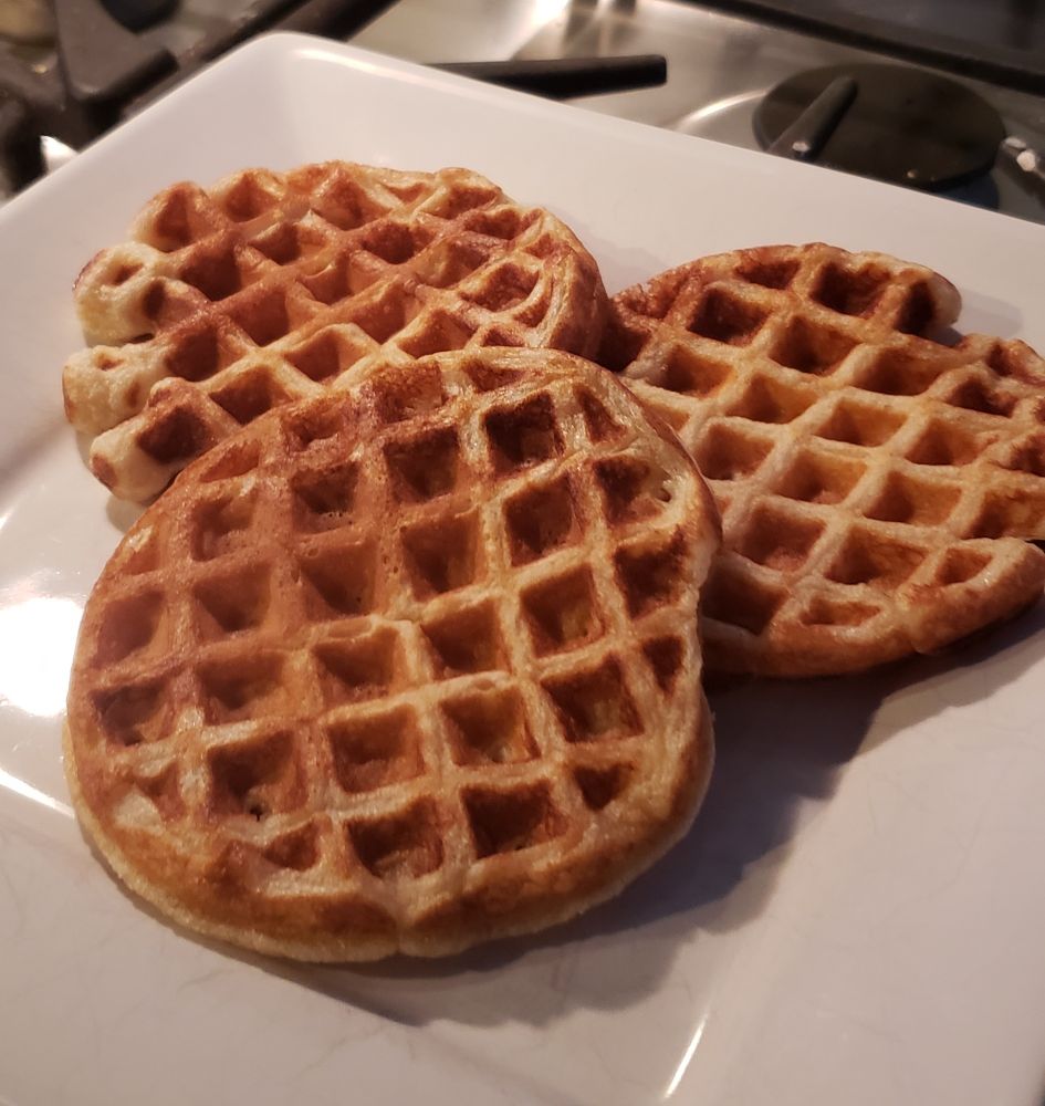 3 mini waffles on a plate. 