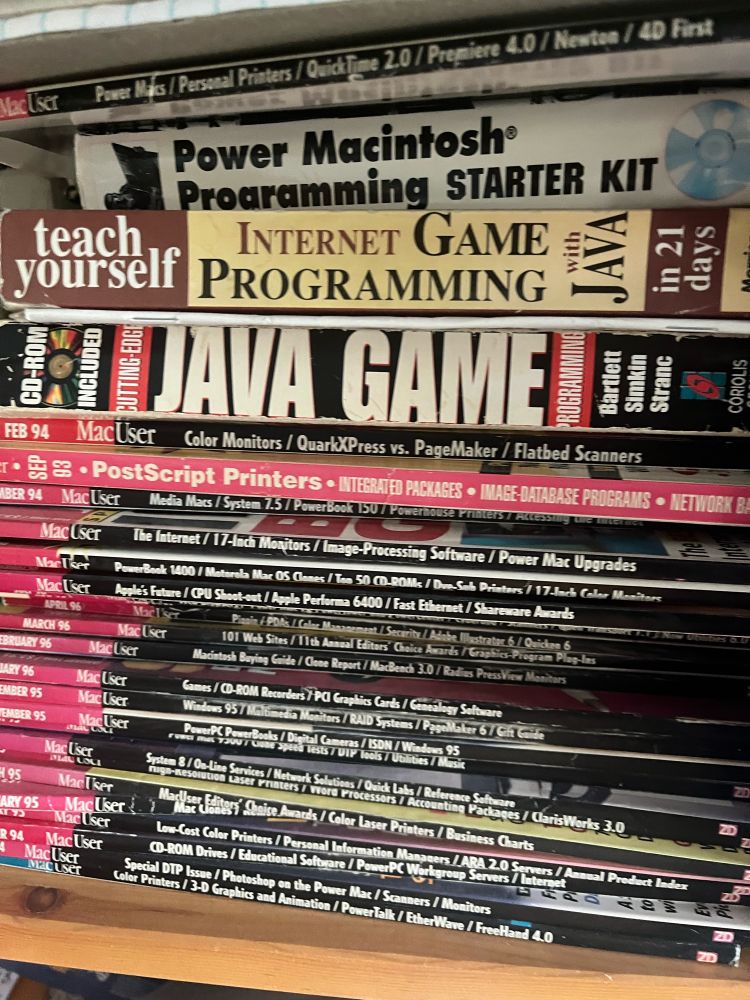 An entire stack of MacUser magazines from the mid 90s along with a few books on learning to program Java games 
