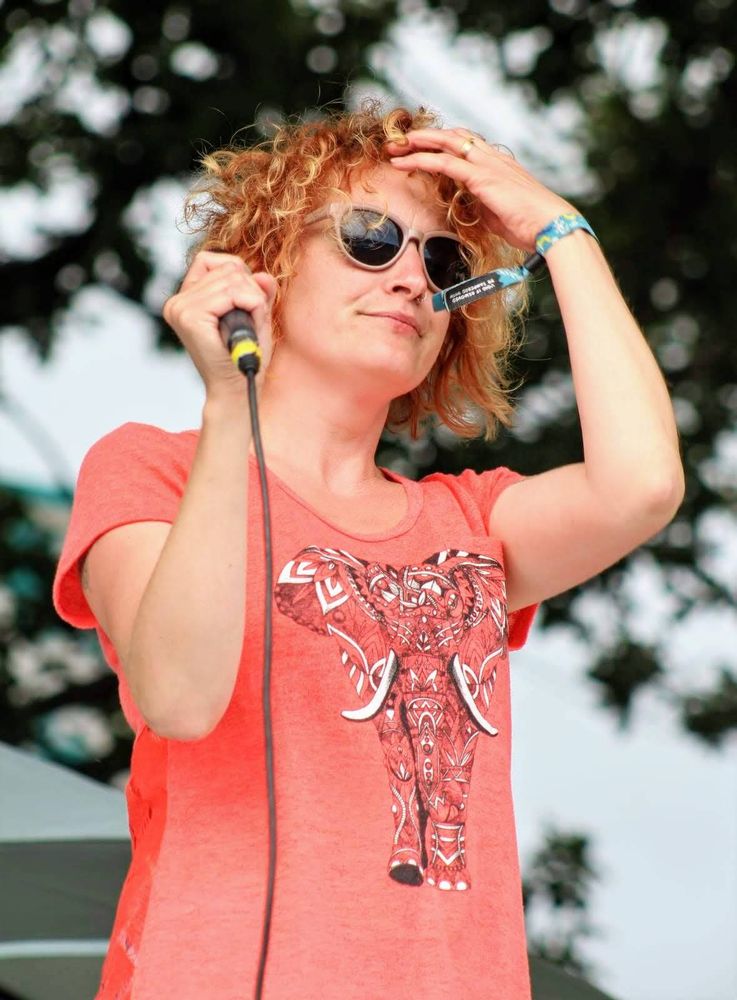 Close up of Stacy during a Wherewithal gig at a summer festival