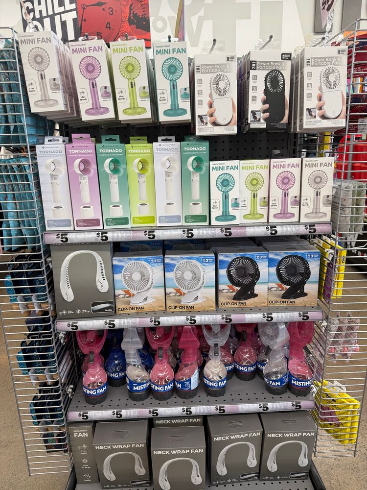 A store endcap display with a variety of handheld and portable fans. 