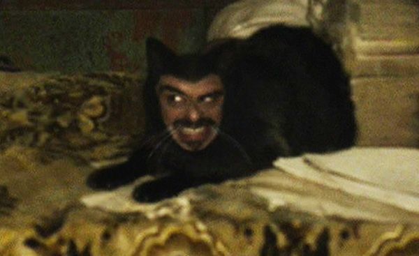 Vladislav from the “What we do in the shadows” movie as a black cat with a human face.