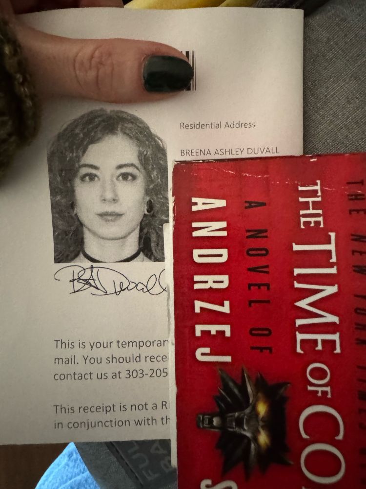 My temp license with new last name and fantastic ID photo