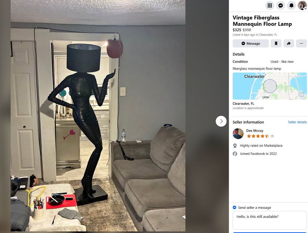 a lamp on facebook marketplace. it is a life-size mannequin of a woman wrapped in black head to toe, with a large black cylinder lampshade for the head 