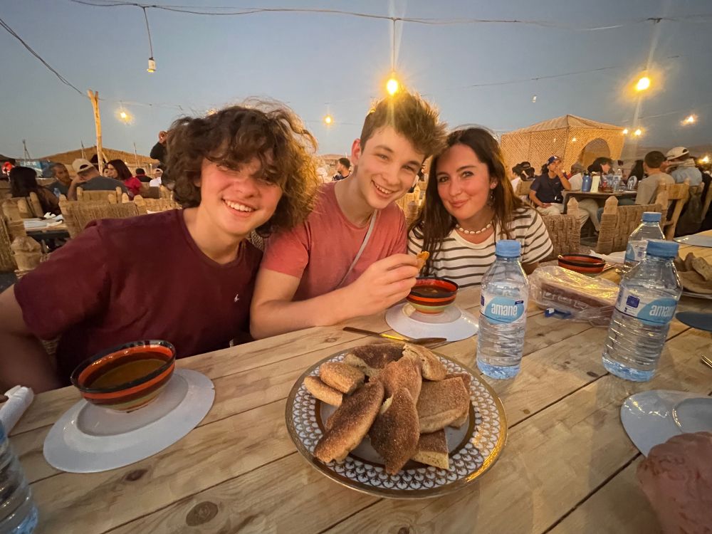 My three kids at the dinner table, pre-desert party