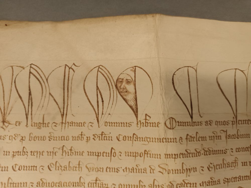 When the deeds have eyes...really fantastic portraiture, possibly of Edward III, in a English royal charter sent to Ireland in 1375 at @nlireland.bsky.social The face is drawn into the loop of the h for hib[er]nie or Ireland, and has a rather Big Brother (or Edward) is watching you feeling.