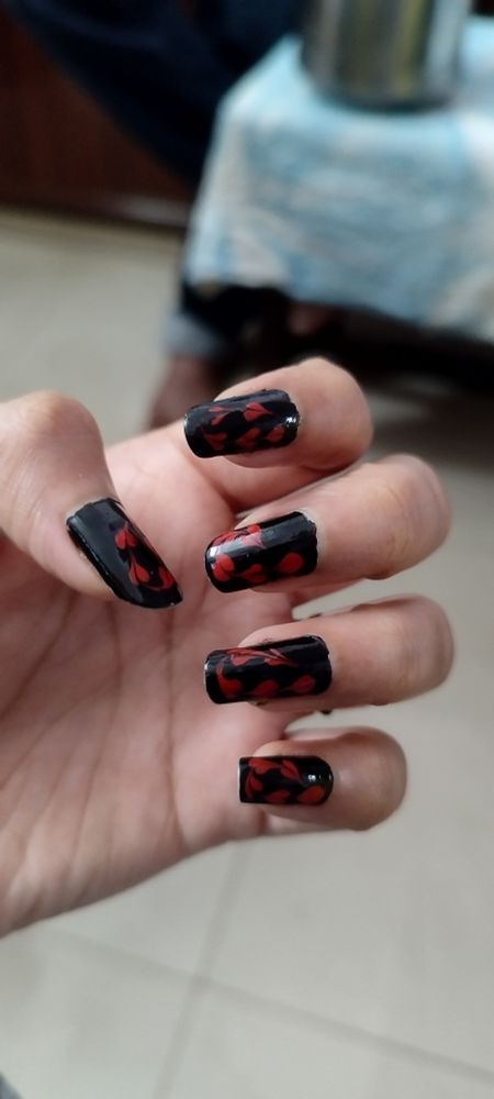 Picture of fingers showing most basic nail art with black and red color combo