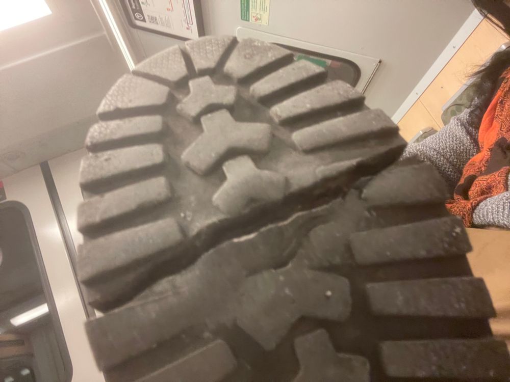 A boot sole, split entirely in two on the ball of the foot.