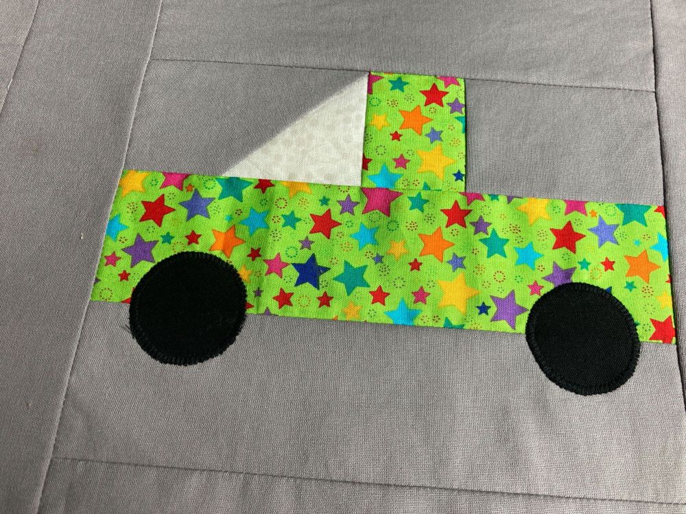 Another ute/pickup truck quilt block. This one is lime green with colourful stars all over it.