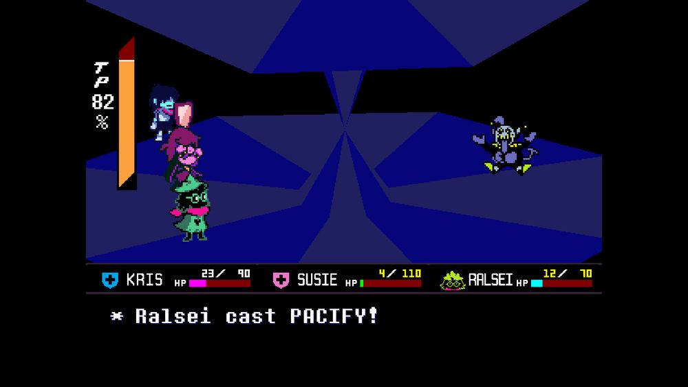 screenshot from Deltarune
The fight screen of the Jevil fight, featuring a low-poly carousel stage. the text at the bottom of the screen reads "* Ralsei cast PACIFY!", signaling the completion of the pacifist fight against the boss.