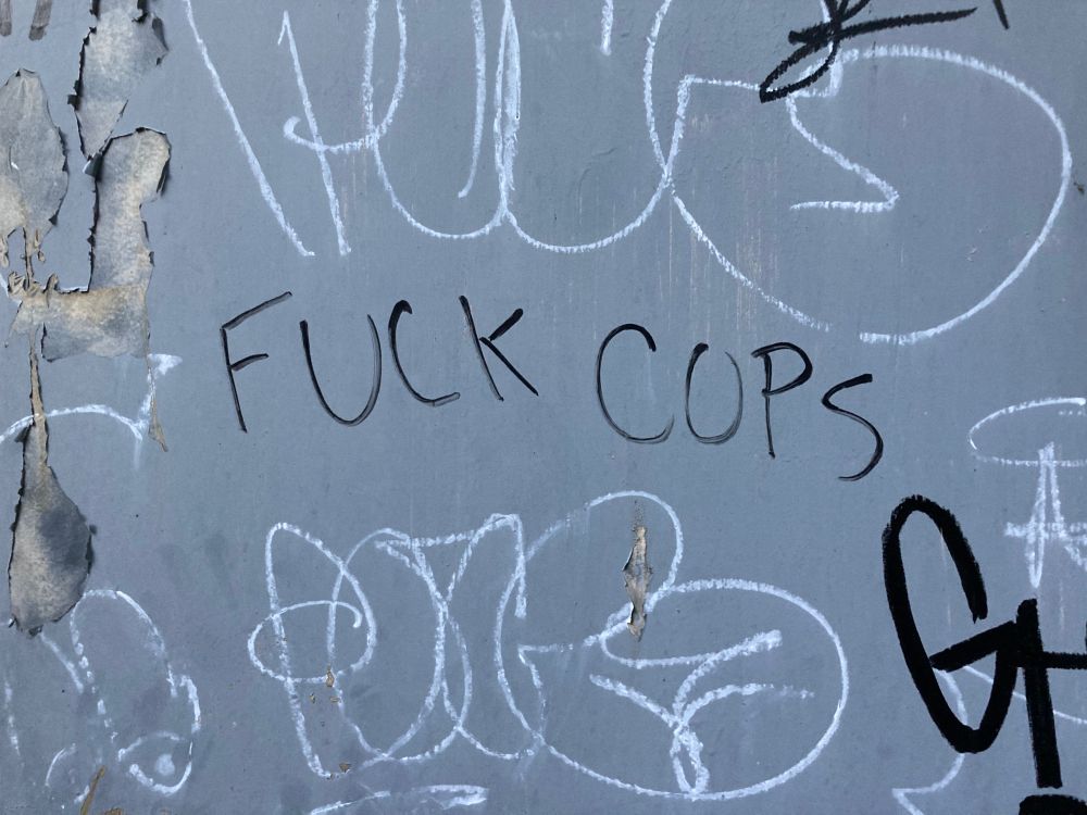 Graffiti that reads “fuck cops“, but the O looks like a U
