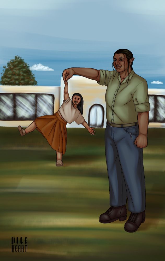 Desislava and Imogene stand in a field of grass by a building. Desislava is closer to the foreground, pretending to hold Imogene in the air with one hand. Further back, Imogene pretends to dangle from Desislav's hand.