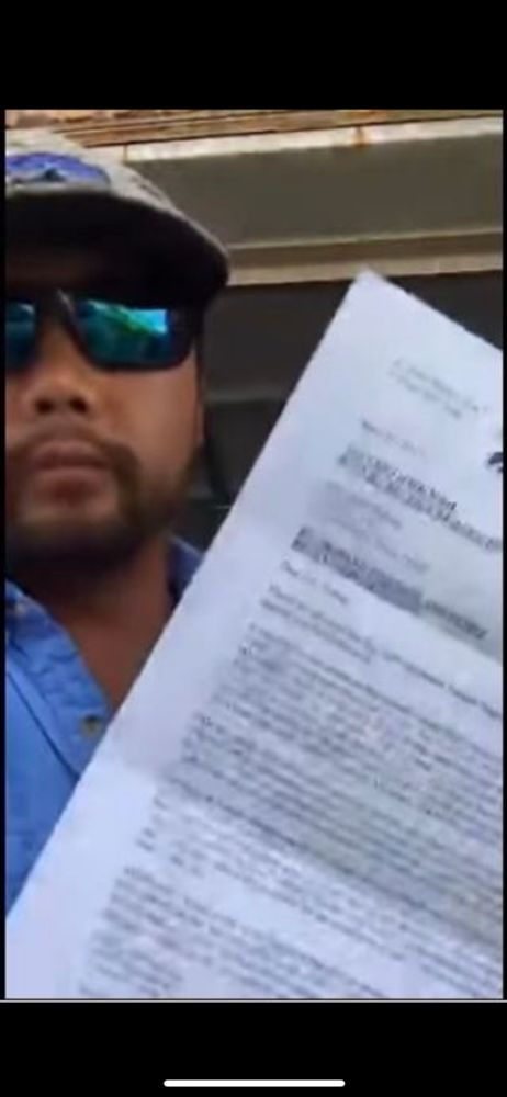 James Huling holding the “cease and assist” from Nat Nat 