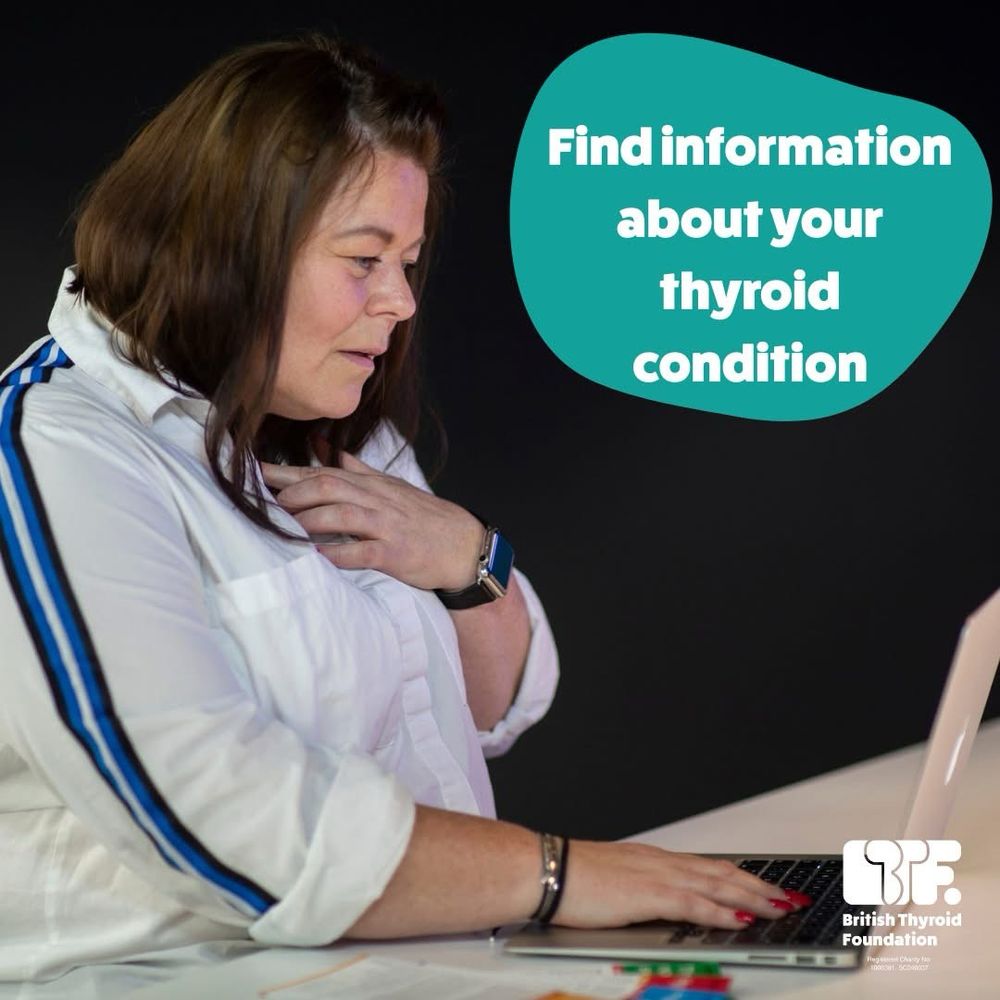 Woman wearing white shirt is sitting at her laptop. She is holding her lower neck with her left hand. Caption reads: Find information about your thyroid condition.