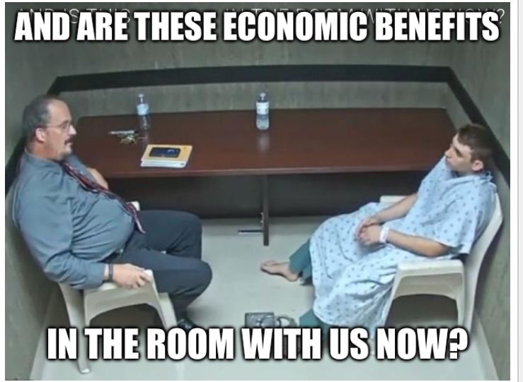 A scene in an interview room, featuring an interviewee in a hospital gown. The text of the question being posed by the interviewer reads “And are these economic benefits in the room with us now?”
