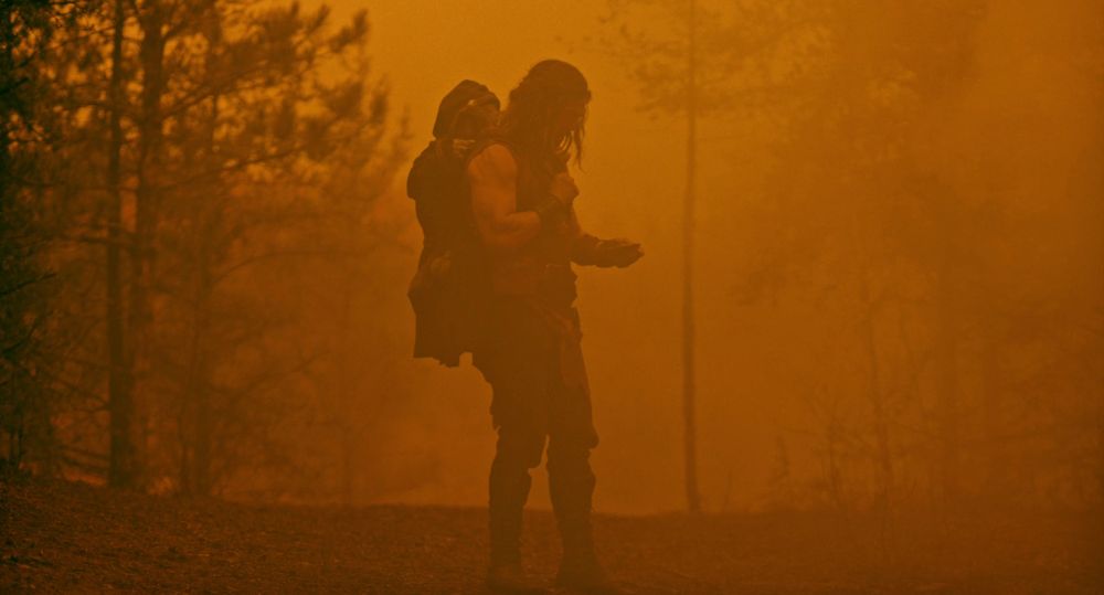 Bernhardt standing in the middle of a forest with a tiny wizard naemd Doodad on his back, the whole frame/forest the color of a tobacco stain 