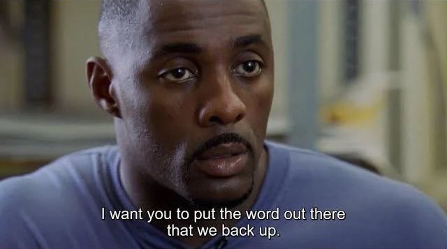 closeup on Idris Elba/Stringer Bell with caption "I want you to put the word out there that we back up." 